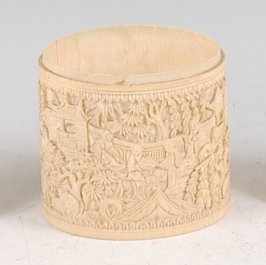 Lot 1363 - A circa 1900 Chinese relief carved ivory wrist...