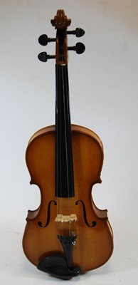 Lot 610 - A 20th century violin, having a two piece back...