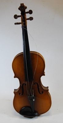 Lot 611 - A 20th century violin, having a two piece back...