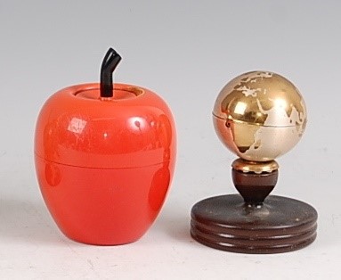 Lot 200 - A novelty table lighter modelled as a globe,...