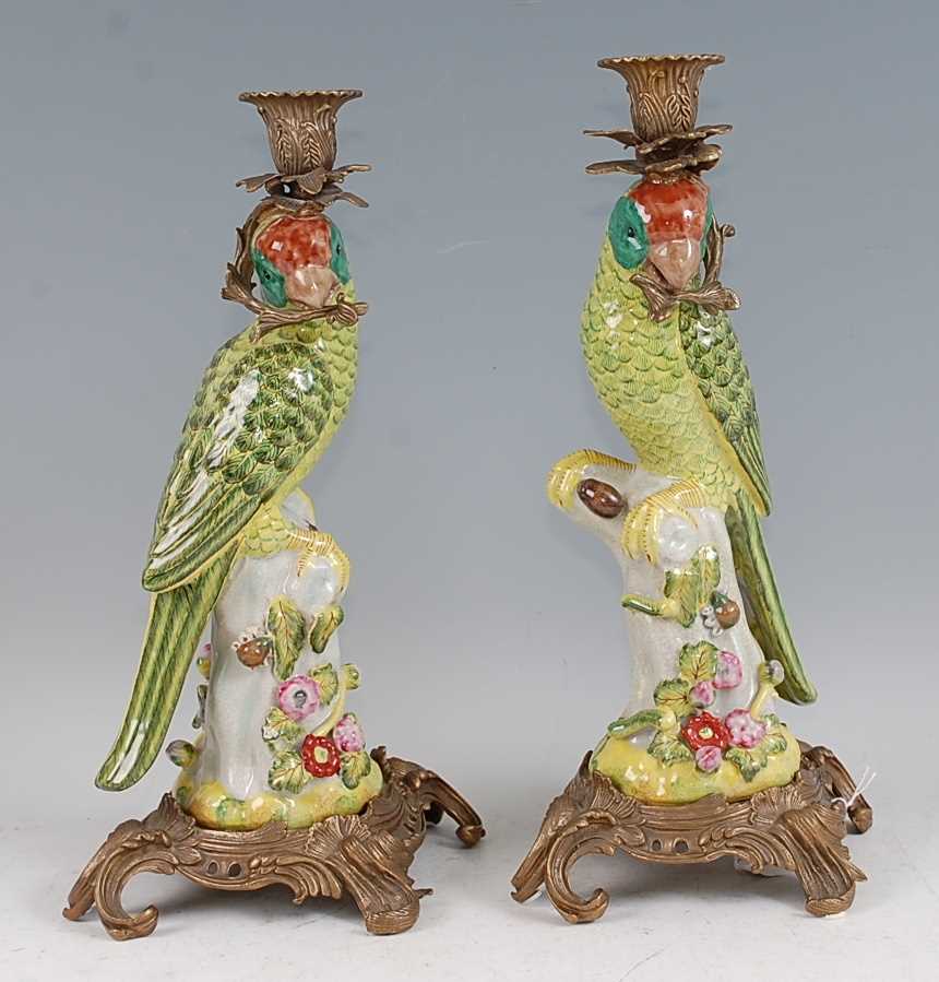Lot 1069 - A pair of reproduction porcelain candlesticks,...
