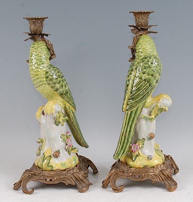 Lot 1069 - A pair of reproduction porcelain candlesticks,...