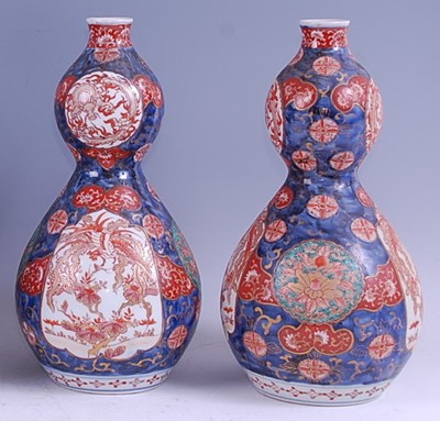 Lot 1353 - A pair of Japanese Meiji period double gourd...