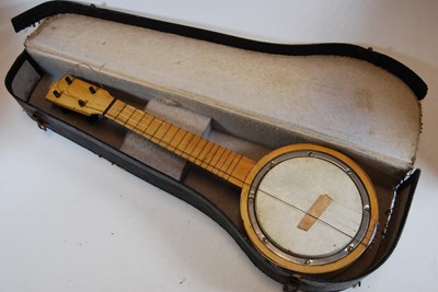 Lot 618 - A 20th century four string banjolele, bearing...