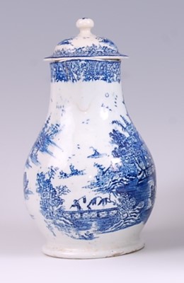 Lot 1038 - A Lowestoft porcelain milk jug and cover, blue...