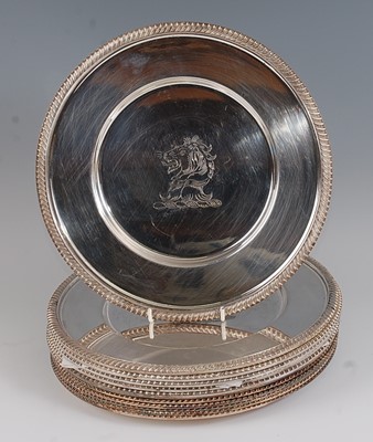 Lot 1174 - A set of twelve silver plated dinner plates,...