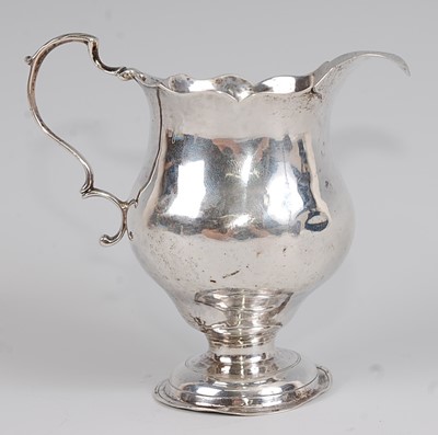 Lot 1179 - *An early George III silver pedestal cream jug,...