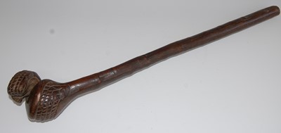 Lot 1342 - An early 20th century tribal club, probably...