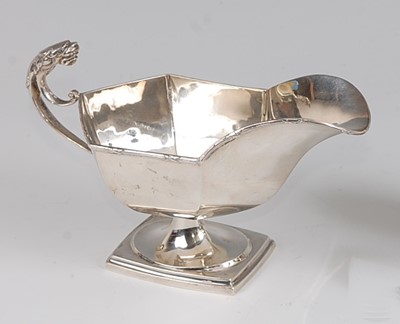 Lot 103 - An early Art Deco silver pedestal sauce-boat,...