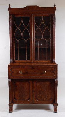 Lot 1544 - A Regency mahogany secretaire bookcase, the...