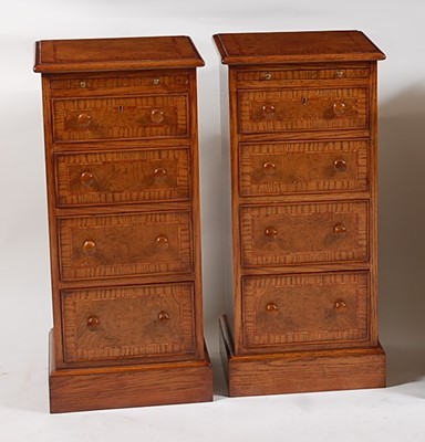 Lot 1506 - A pair of oak and burr oak four-drawer bedside...