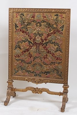 Lot 1534 - A Victorian giltwood and gesso fire screen, ...