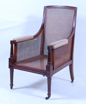 Lot 1598 - *A 19th century mahogany bergère library...