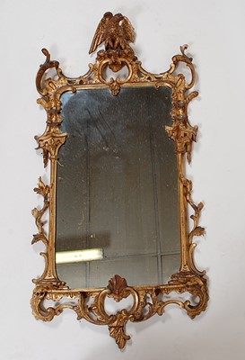 Lot 1561 - *A Rococo Revival carved giltwood pier glass,...