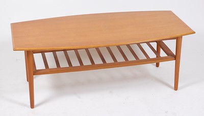 Lot 327 - A 1960s teak low coffee table, having bowed...