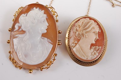 Lot 2647 - Two oval carved shell cameo brooches, one with...