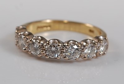 Lot 2656 - An 18ct yellow and white gold diamond seven...