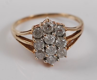 Lot 2681 - A 9ct yellow gold diamond oblong cluster ring,...