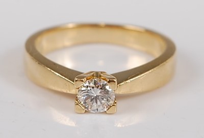Lot 2597 - A yellow metal diamond single stone ring,...