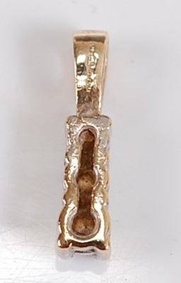 Lot 2605 - A 9ct yellow gold diamond pendant, comprising...