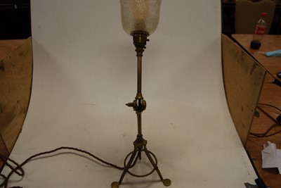Lot 1 - An Edwardian adjustable brass table lamp, the...