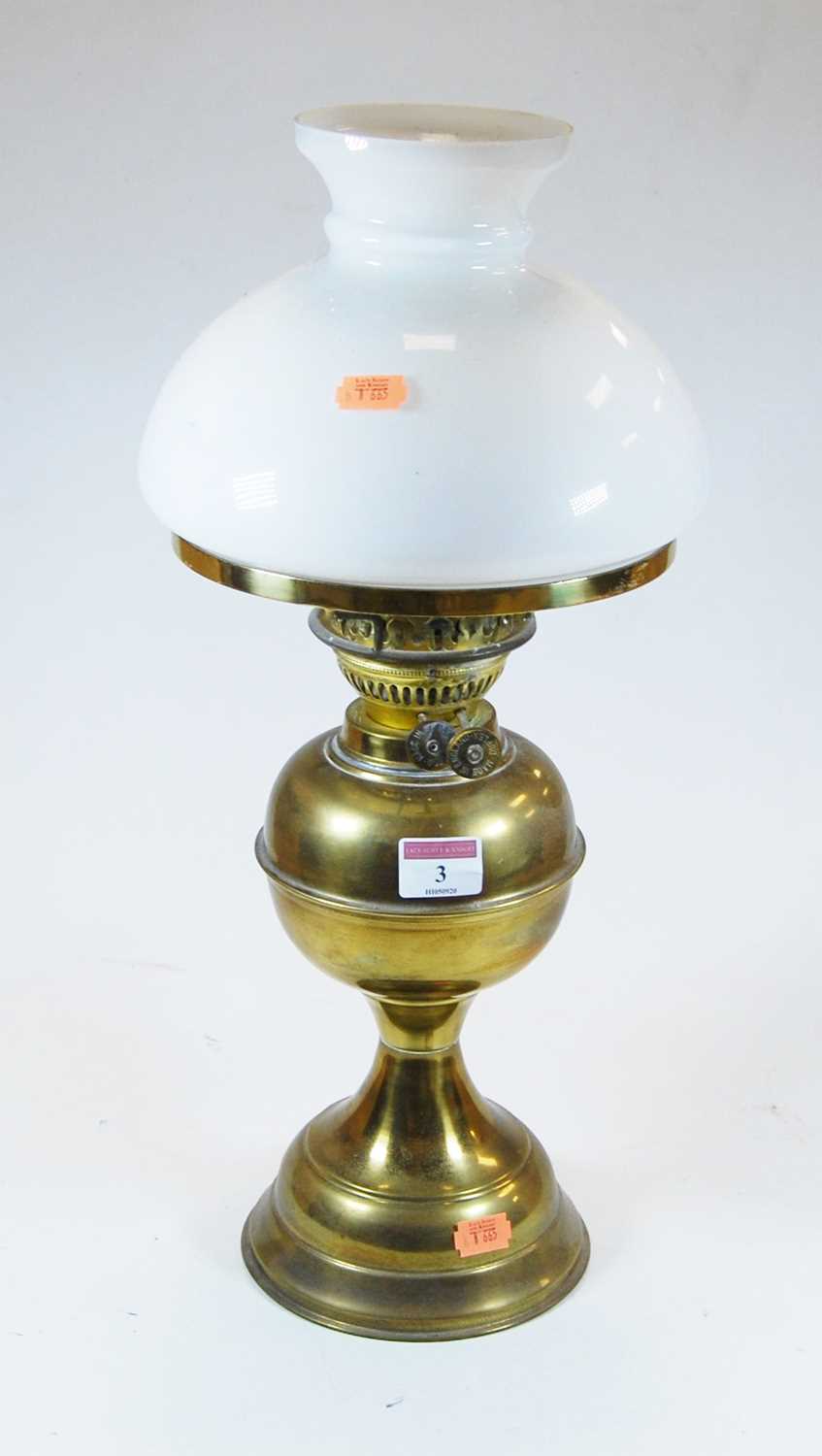 Lot 3 - An early 20th century glass oil lamp, the milk...