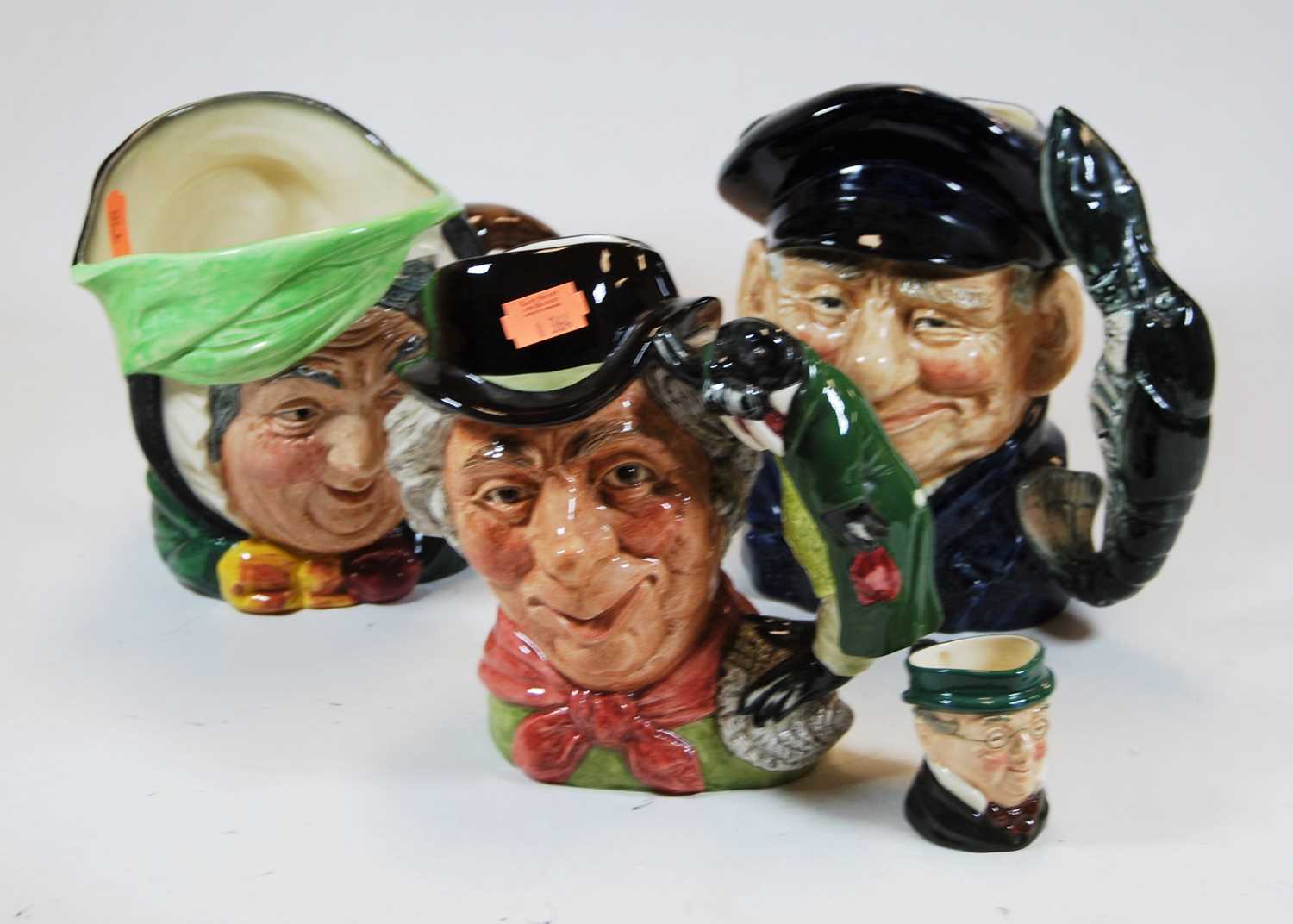 Lot 5 - A collection of four Royal Doulton character...