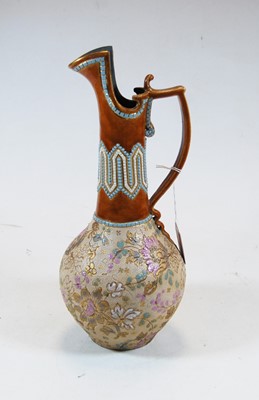 Lot 7 - A Royal Doulton stoneware ewer, with beaded...