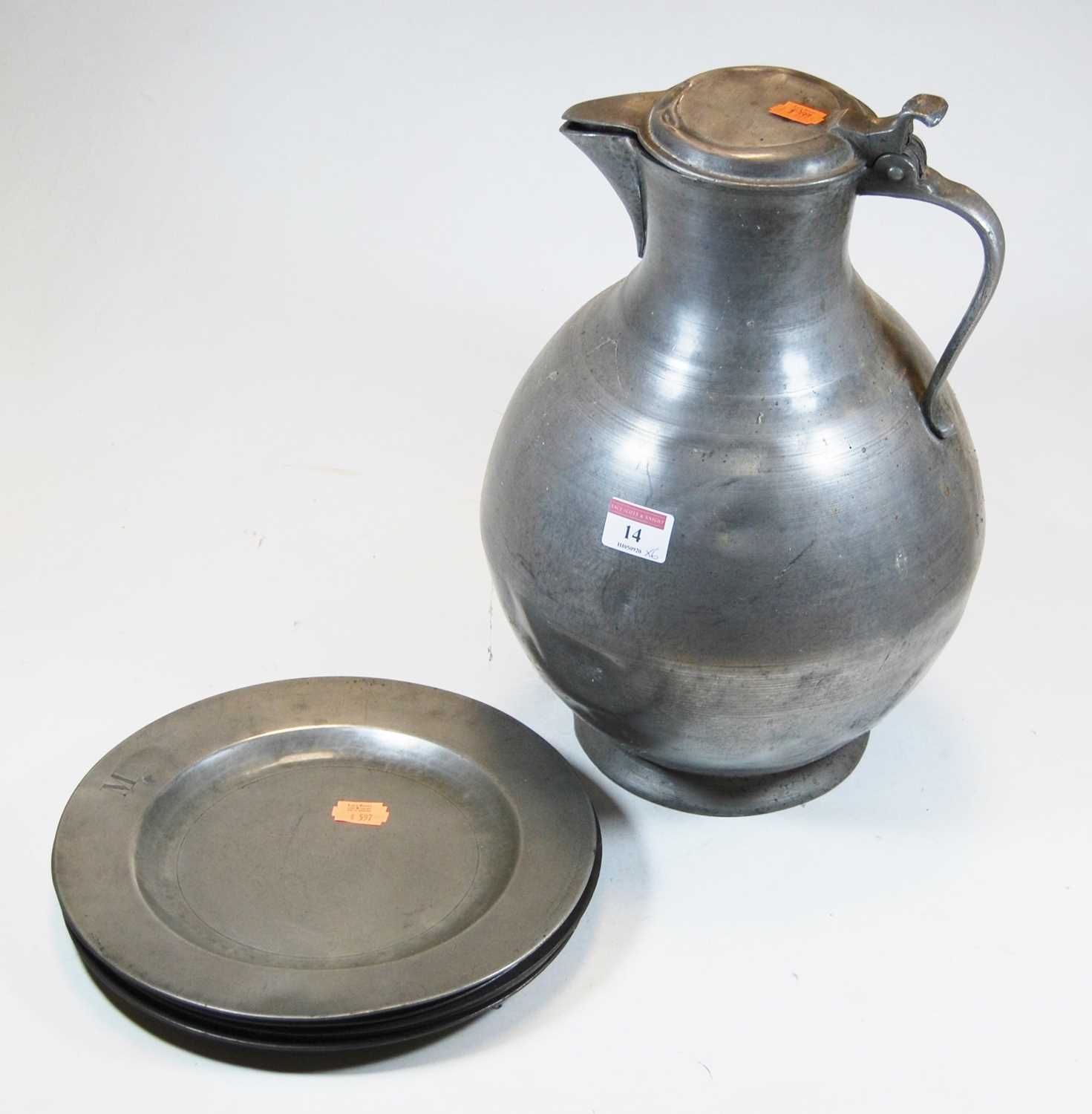 Lot 14 - A large pewter water jug, of globular form,...