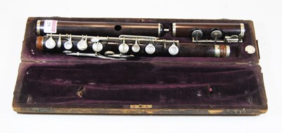 Lot 29 - A 20th century *rosewood flute* cased, the...