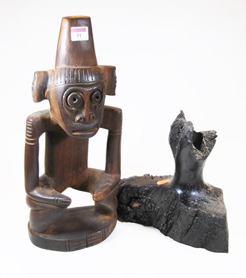 Lot 31 - A 20th century carved hardwood figure of a...