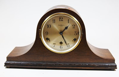 Lot 60 - An early 20th century oak cased mantel clock,...