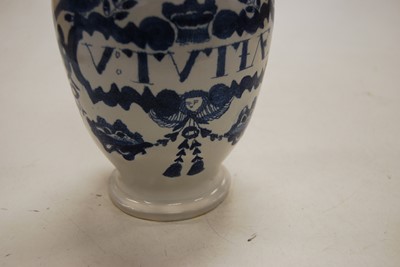 Lot 199 - An 18th century Delft wet drug vase (restored)...