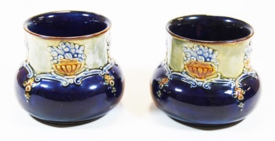 Lot 210 - A pair of Royal Doulton stoneware squat vases...