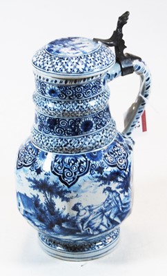Lot 212 - A 19th century Dutch Delft stein with hinge...