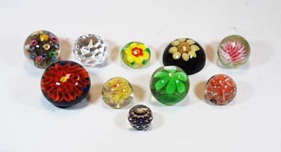 Lot 229 - A collection of ten various glass paperweights...
