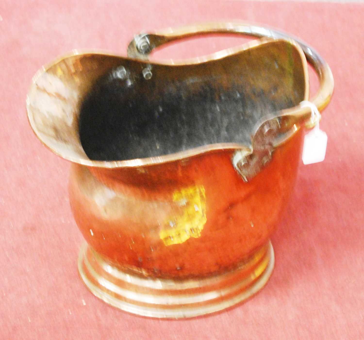 Lot 154 - A late 19th century copper helmet shaped coal...