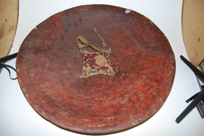 Lot 161 - A 19th century leather clad dhal shield, of...