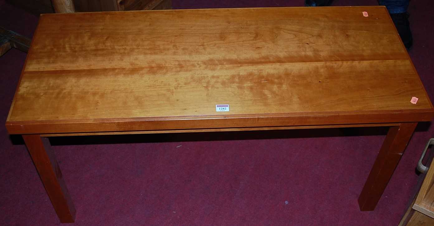 Lot 1282 - A contemporary cherry wood coffee table,...