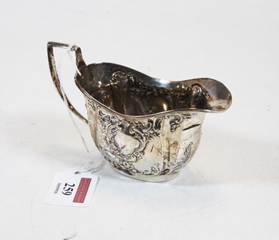 Lot 259 - A late Victorian silver and embossed cream jug,...