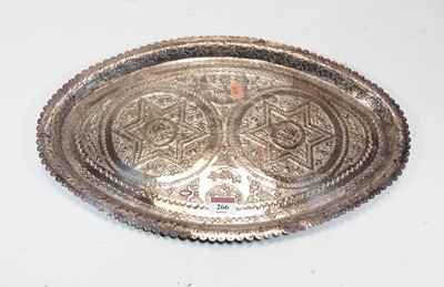 Lot 266 - An middle eastern white metal oval tray with...