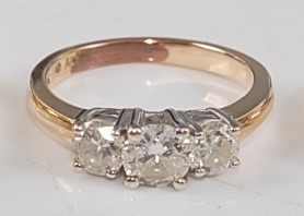 Lot 2588 - A yellow metal diamond three-stone ring,...