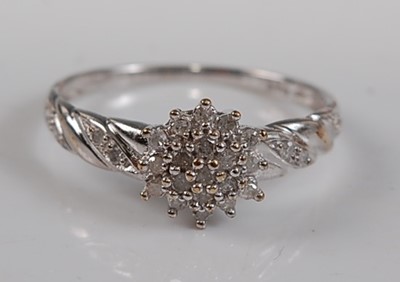 Lot 2613 - A 9ct white gold diamond circular cluster ring,...