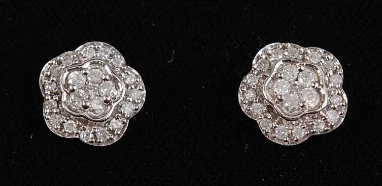 Lot 2658 - A pair of 9ct white gold diamond flower shaped...