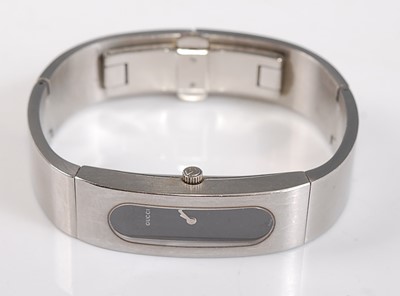 Lot 2518 - A lady's stainless steel Gucci bangle quartz...