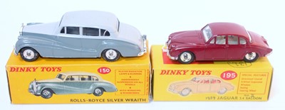 Lot 1965 - A Dinky Toys boxed saloon diecast group to...