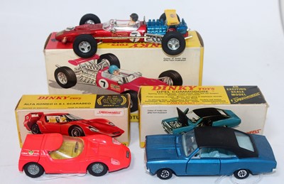 Lot 1966 - A Dinky Toys boxed saloon and race car group...