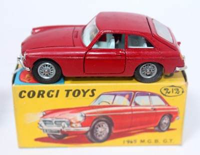 Lot 1621 - A Corgi Toys No. 327 MGB GT comprising of red...