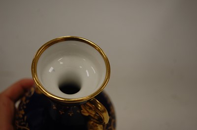 Lot 187 - A Mintons porcelain twin handled pedestal vase,...