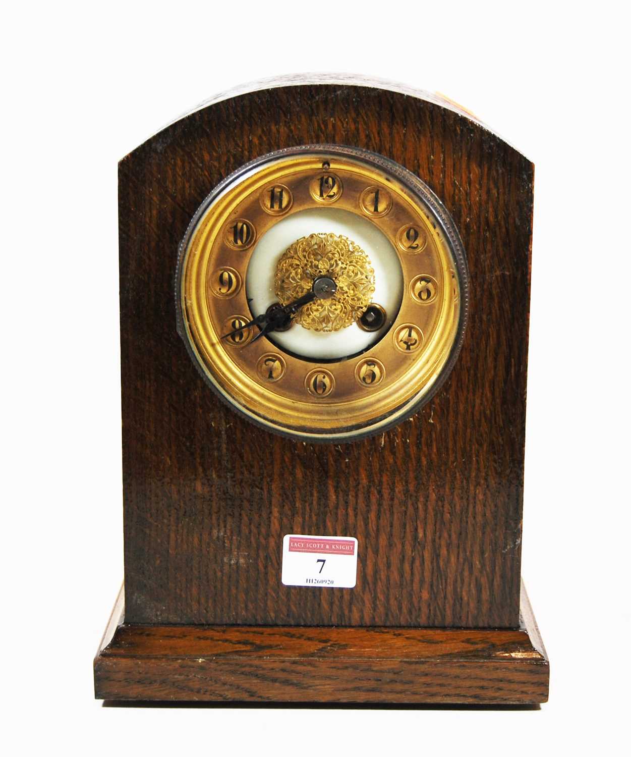 Lot 7 - An early 20th century oak cased mantel clock,...